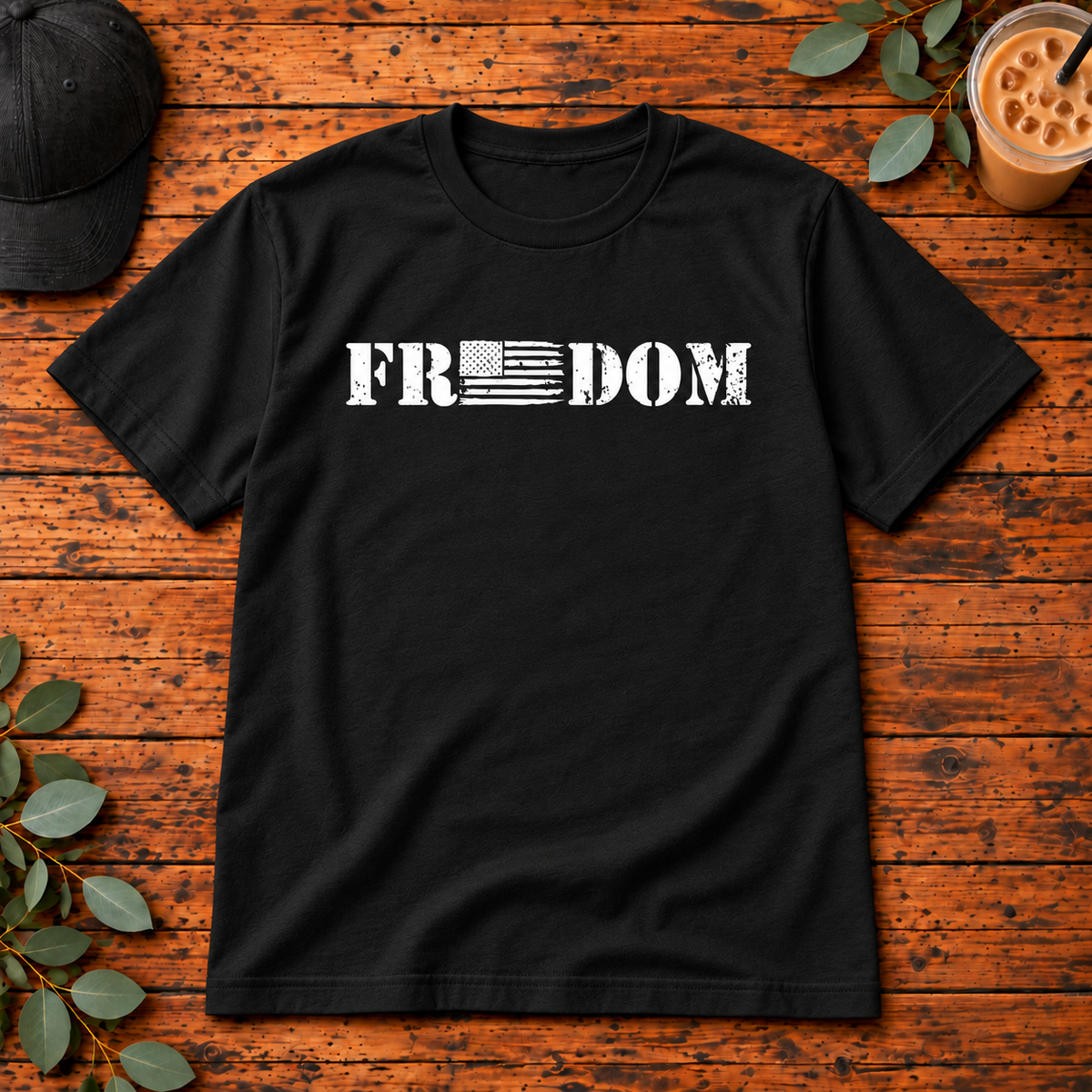 Freedom Flag on Gildan Softstyle Adult Tee — Black — single garment on rustic wood