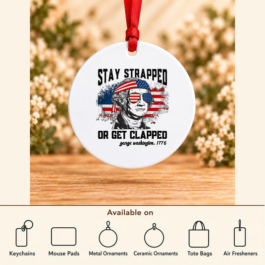 Stay Strapped or Get Clapped — Round Metal Ornament featured; available on keychains, mouse pads, metal ornaments, ceramic ornaments, tote bags and air fresheners