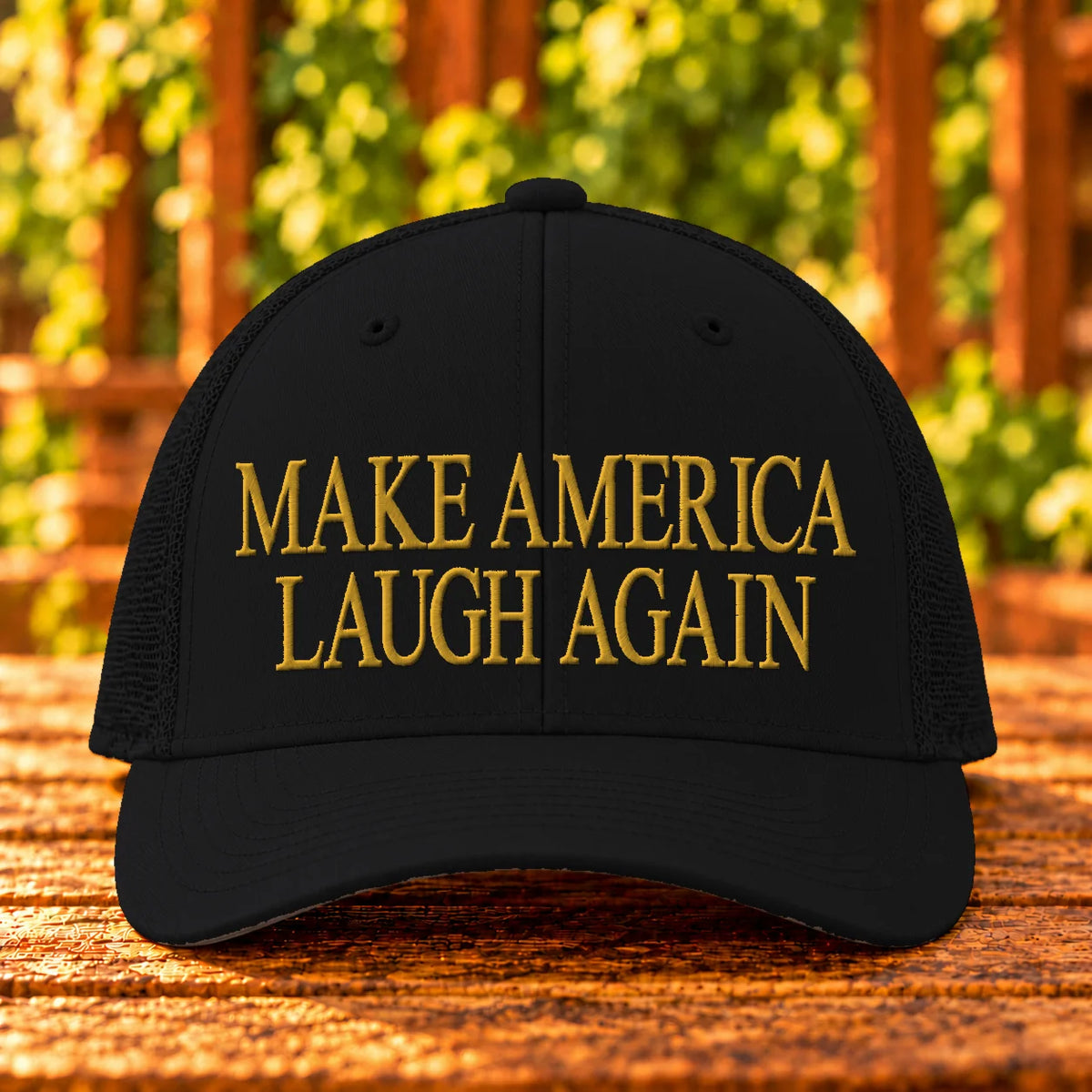 Make America Laugh Again — Black trucker with Gold embroidery