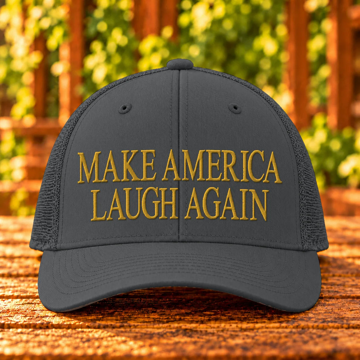 Make America Laugh Again — Charcoal trucker with Gold embroidery
