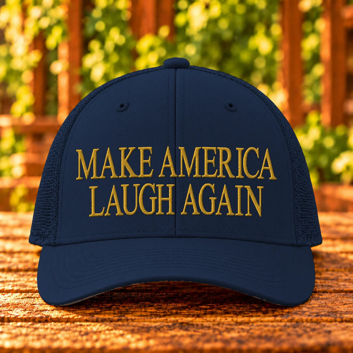 Make America Laugh Again — Navy trucker with Gold embroidery
