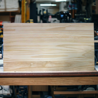 a piece of wood sitting on top of a wooden table