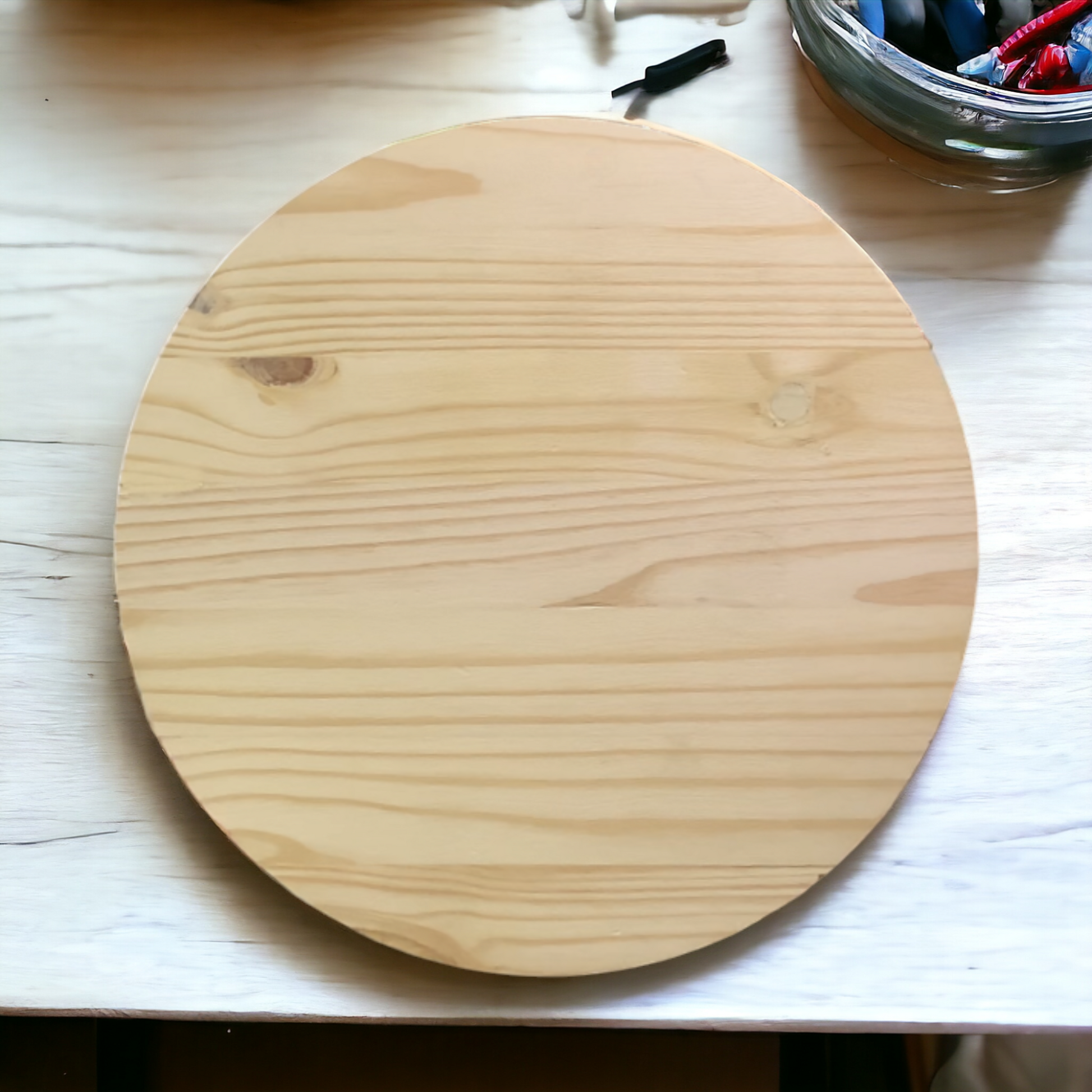 a wooden cutting board sitting on top of a table