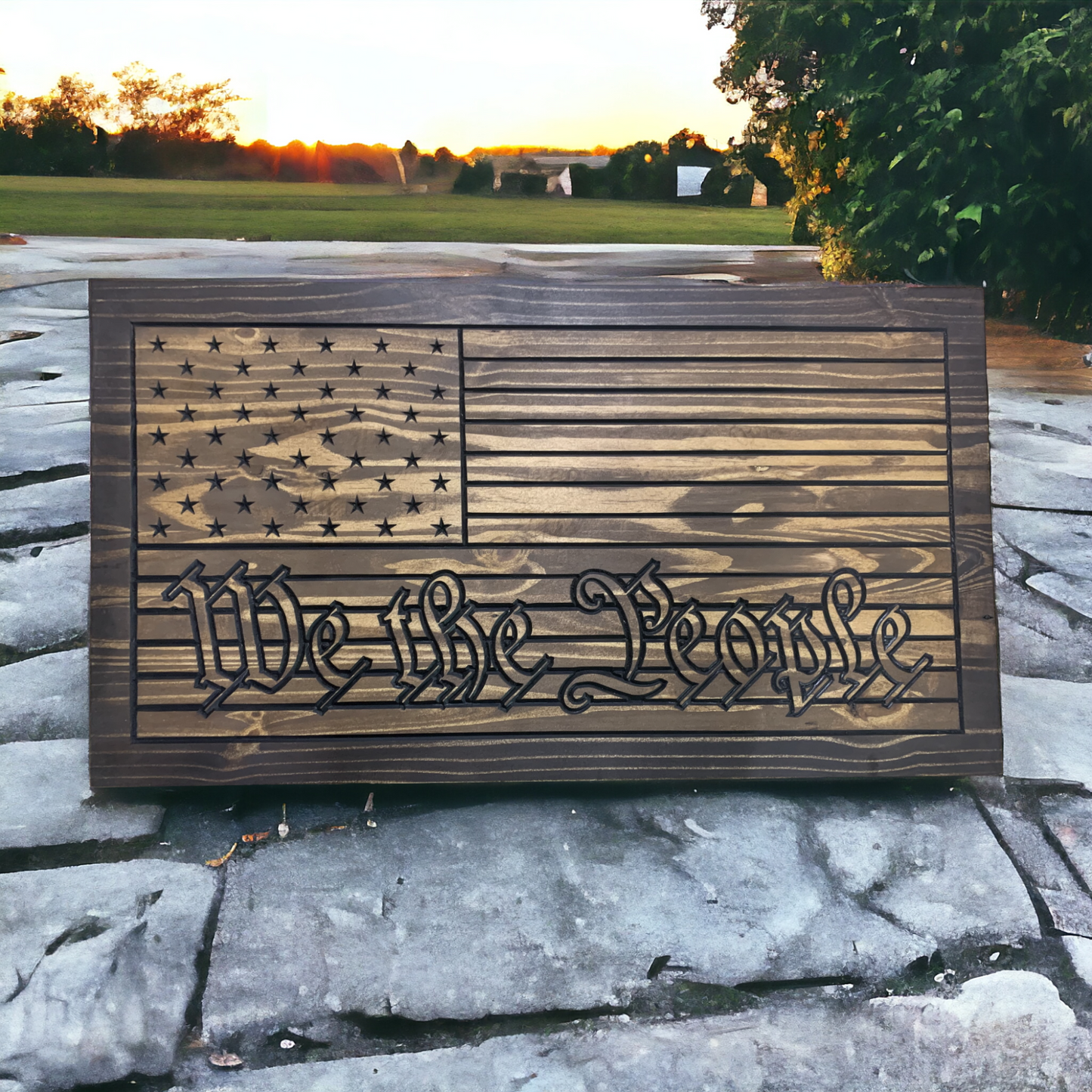 a wooden sign with the words we the people written on it